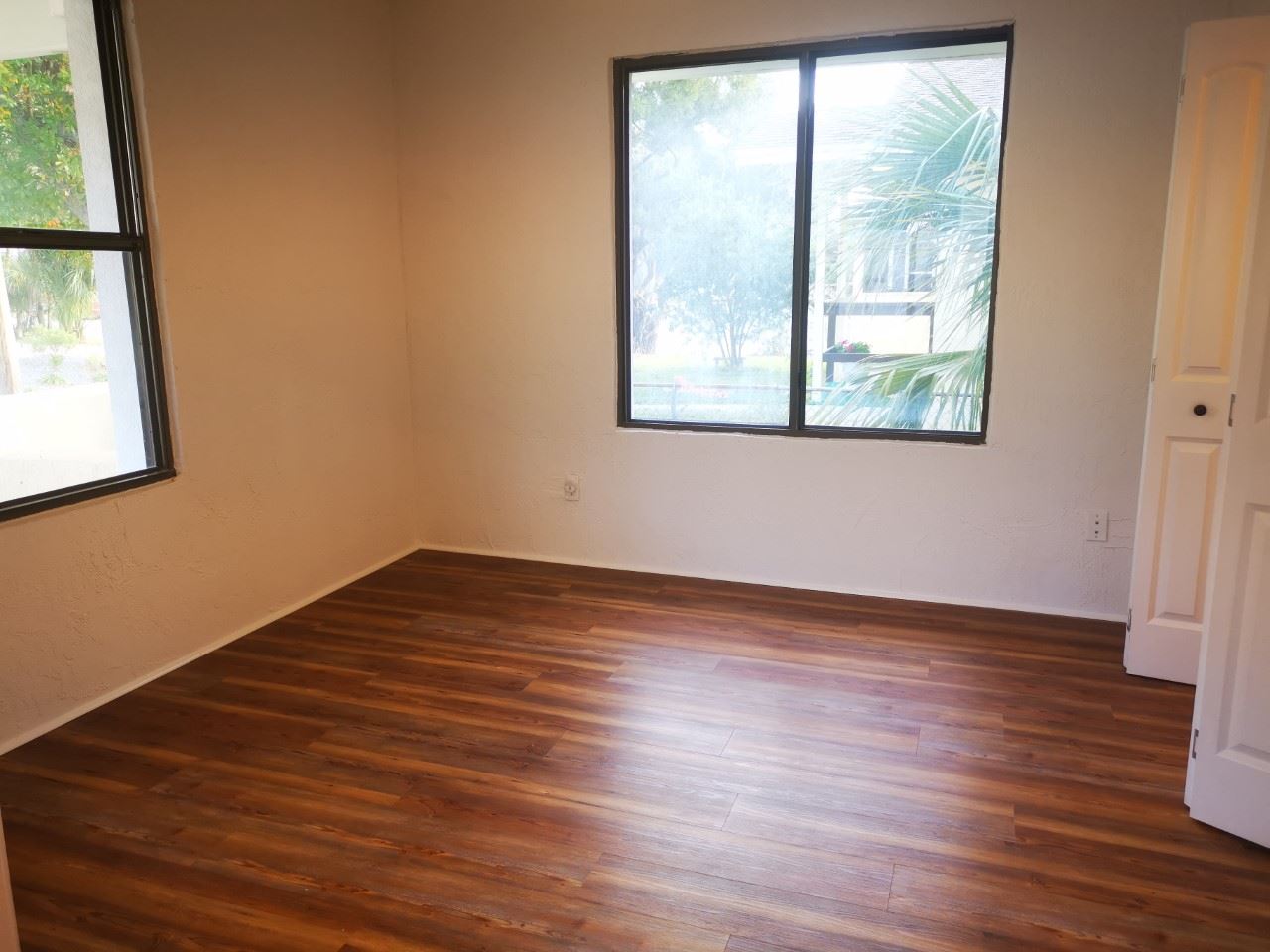 170 Twine Street St. Augustine, FL 32084 - Photo 9 of 24 an empty room with wooden floor and windows