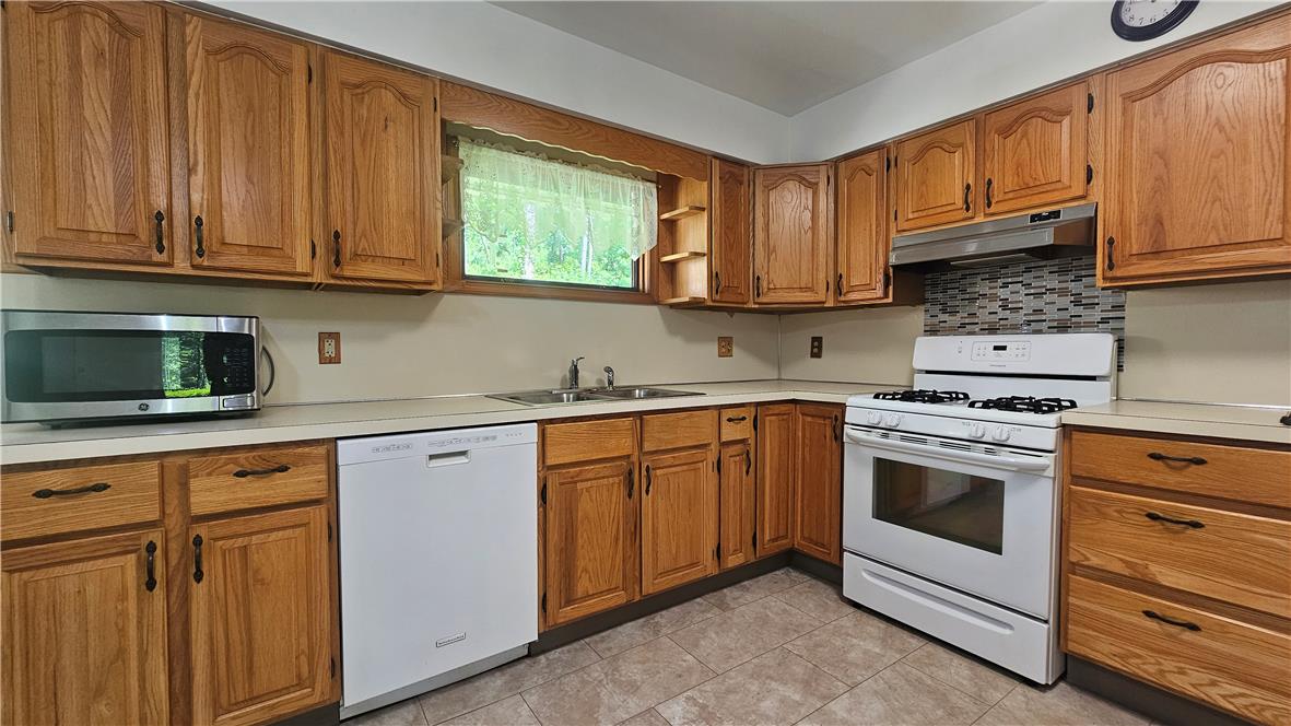 2529 Ringhoffer Road Hellertown, PA 18055 - Photo 6 of 33 A functional kitchen with wood cabinetry and modern appliances awaits culinary creativity.