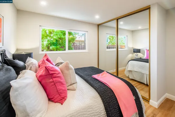 a bedroom with a bed and a couch