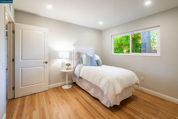 a bed room with a bed and a window