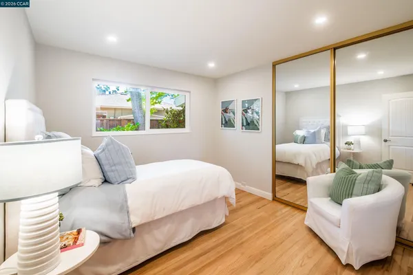 a bedroom with a bed and a couch