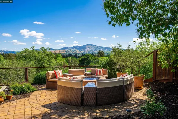 a outdoor living space with furniture and city view