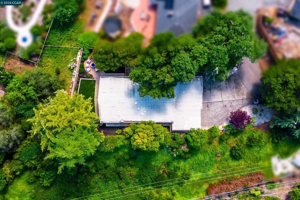 a view of a house with a yard and a garage