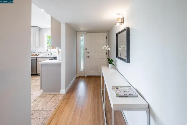 a view of a kitchen from the hallway