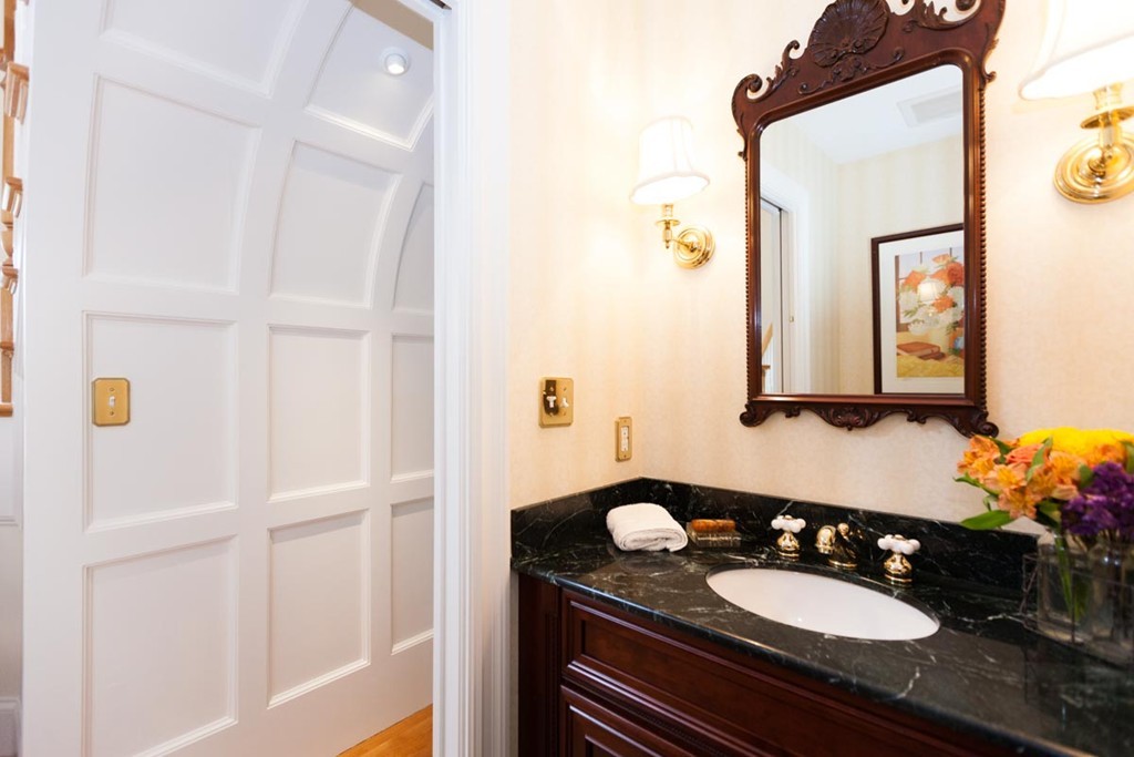 19 North Glen Drive Mashpee, MA 02649 - Photo 11 of 30 a bathroom with a sink vanity granite and a mirror