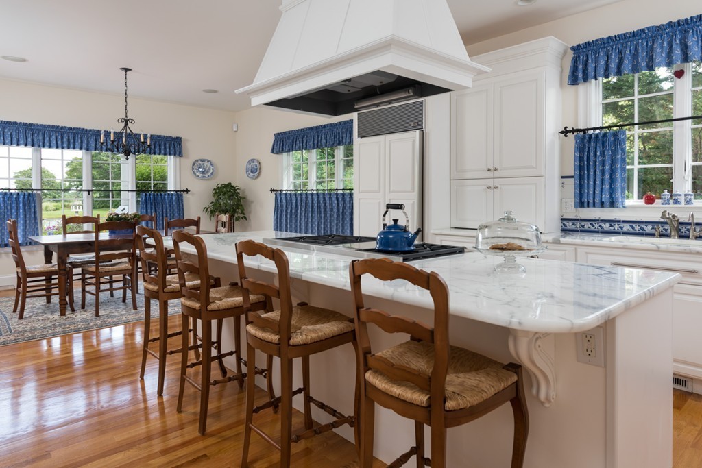 19 North Glen Drive Mashpee, MA 02649 - Photo 15 of 30 a kitchen with granite countertop a sink and a view of living room