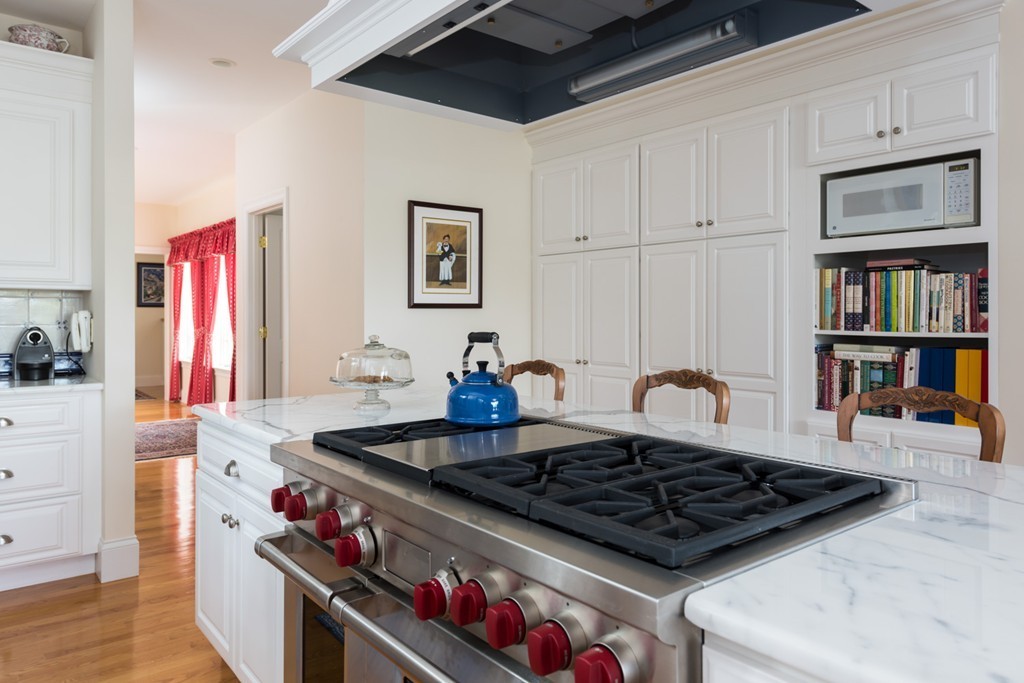 19 North Glen Drive Mashpee, MA 02649 - Photo 16 of 30 a kitchen with stove and cabinets