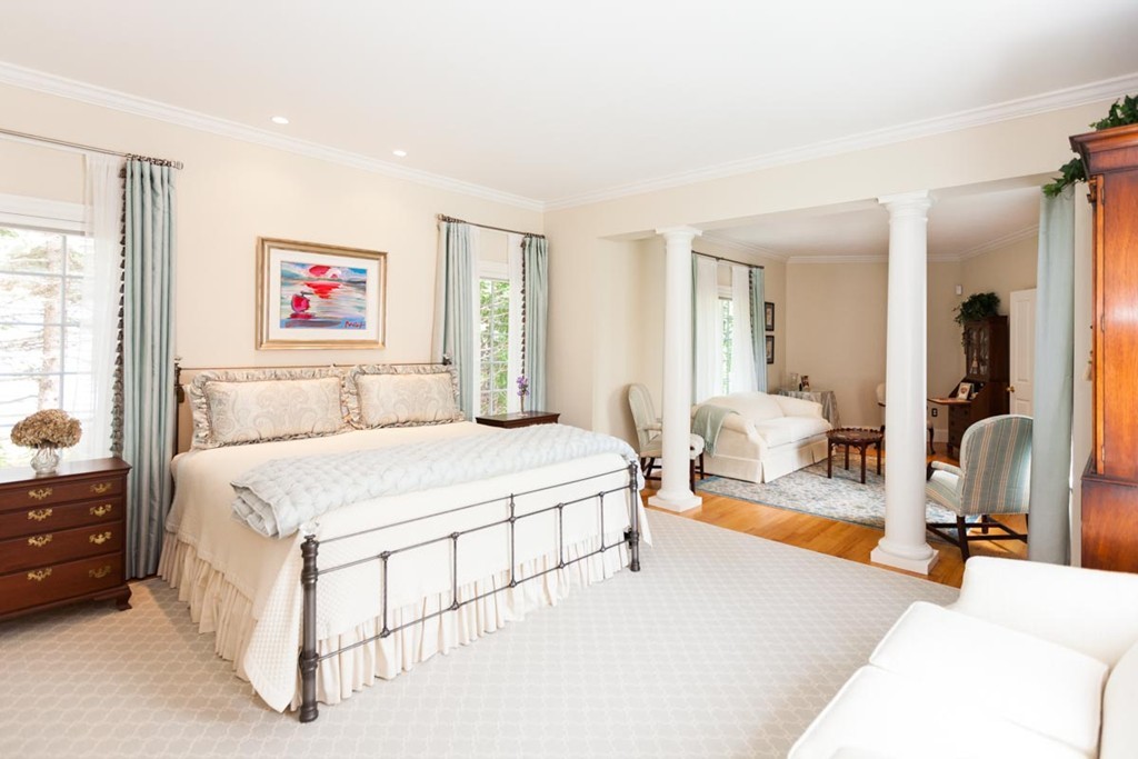 19 North Glen Drive Mashpee, MA 02649 - Photo 21 of 30 a spacious bedroom with a bed a mirror and a window