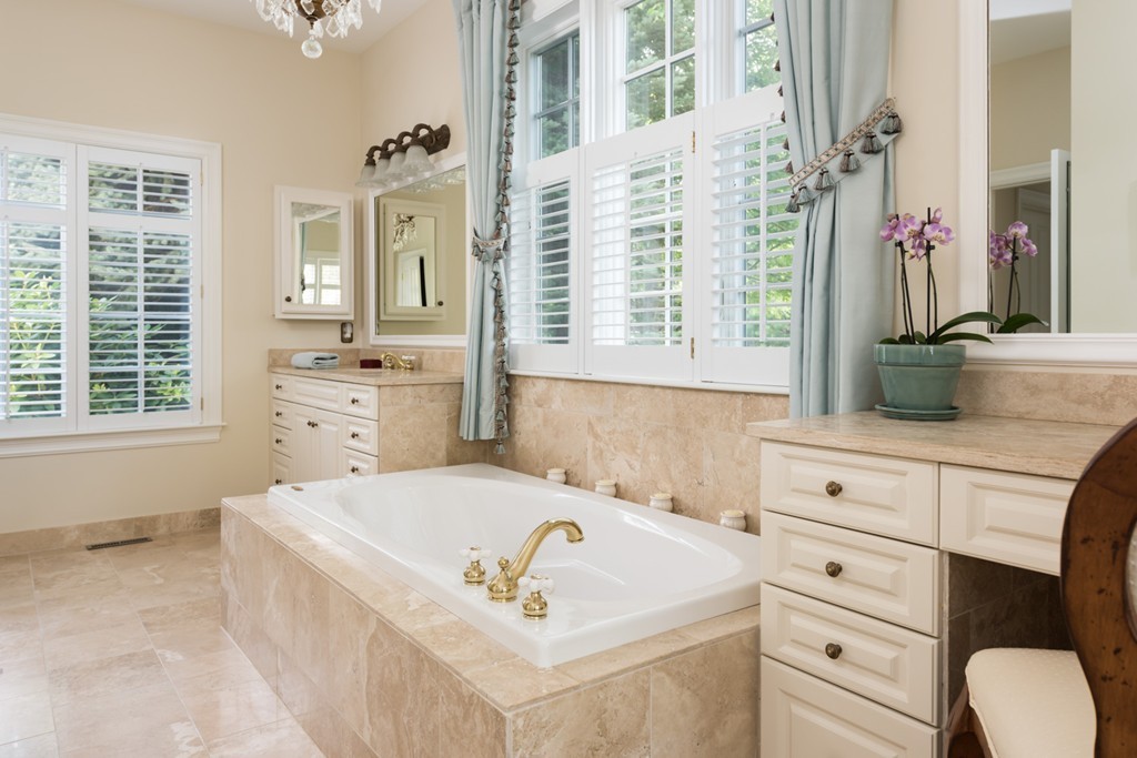 19 North Glen Drive Mashpee, MA 02649 - Photo 23 of 30 a spacious bathroom with a tub sink and mirror