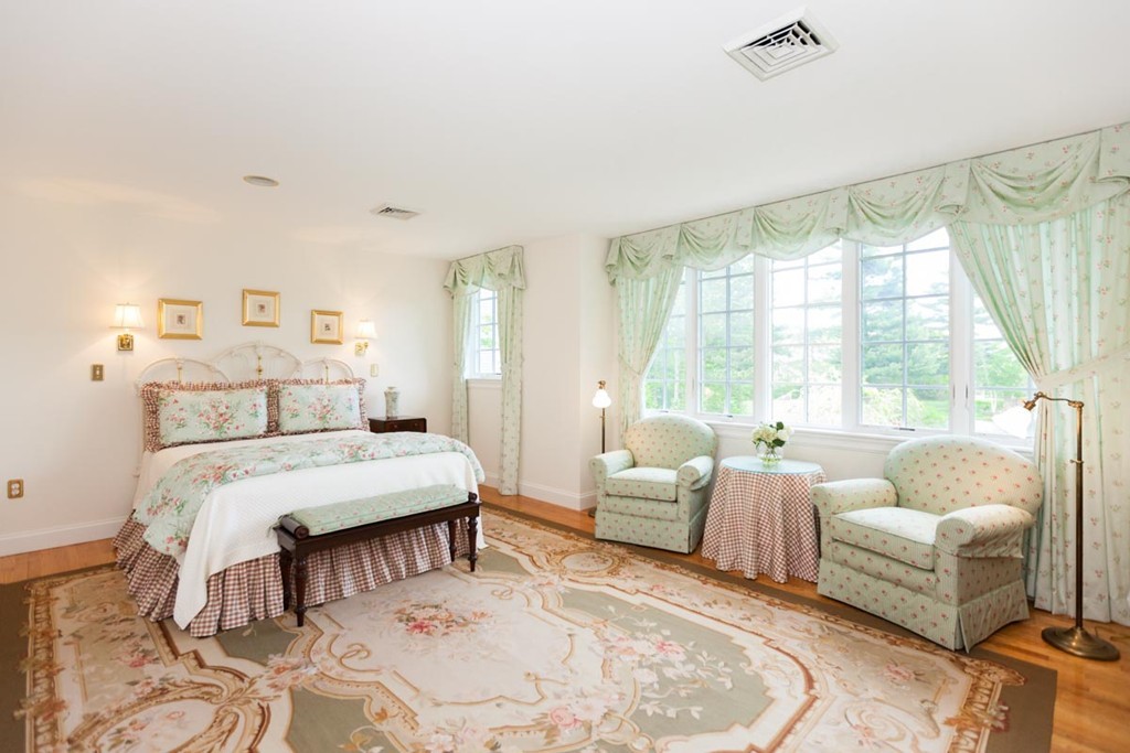 19 North Glen Drive Mashpee, MA 02649 - Photo 24 of 30 a bedroom with a bed and a large window