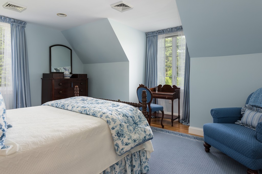 19 North Glen Drive Mashpee, MA 02649 - Photo 26 of 30 a bedroom with a bed and a dresser