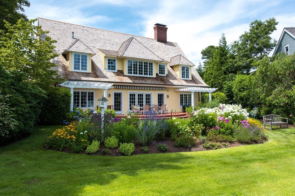 19 North Glen Drive Mashpee, MA 02649 - Photo 29 of 30 a front view of house with yard and green space