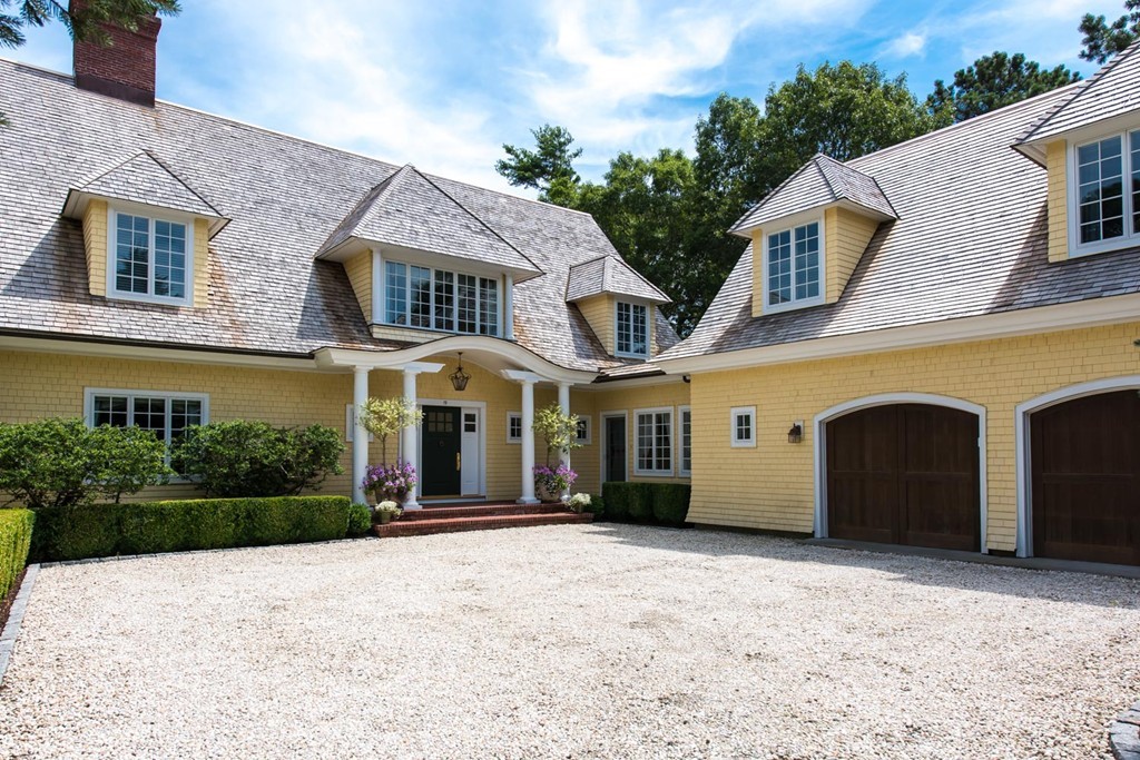 19 North Glen Drive Mashpee, MA 02649 - Photo 5 of 30 a front view of a house with a yard