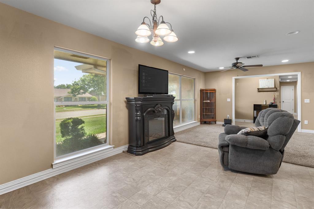 4504 Jennings Avenue Wichita Falls, TX 76310 - Photo 4 of 26 a living room with furniture a flat screen tv and a large window