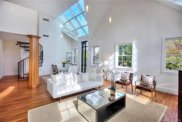 a living room with furniture a fireplace and a table