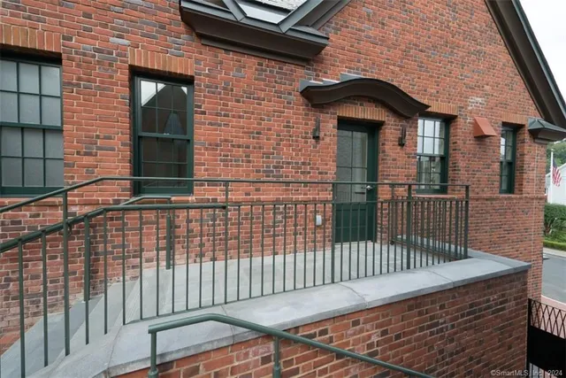 a view of workspace with wooden floor windows