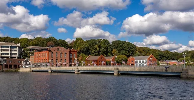 a view of multiple houses with a swimming pool