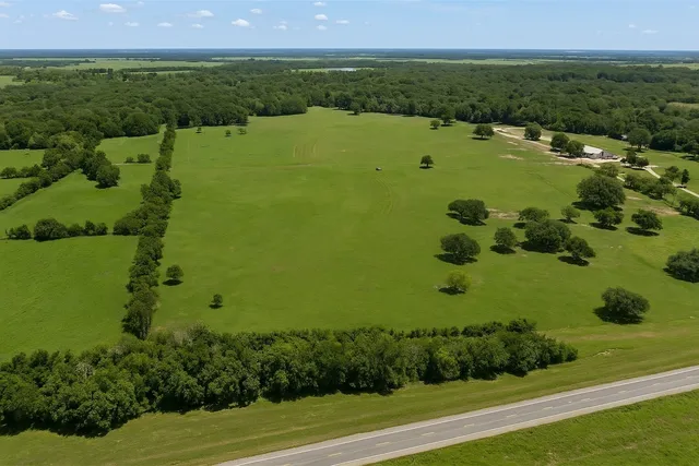 a view of a lake with a yard