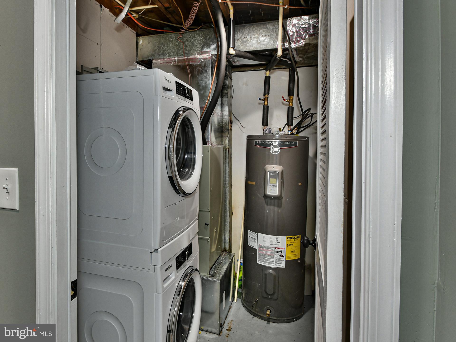 6308 Larwin Drive, Unit (BASEMENT) Temple Hills, MD 20748 - Photo 19 of 23 a utility room with dryer and washer