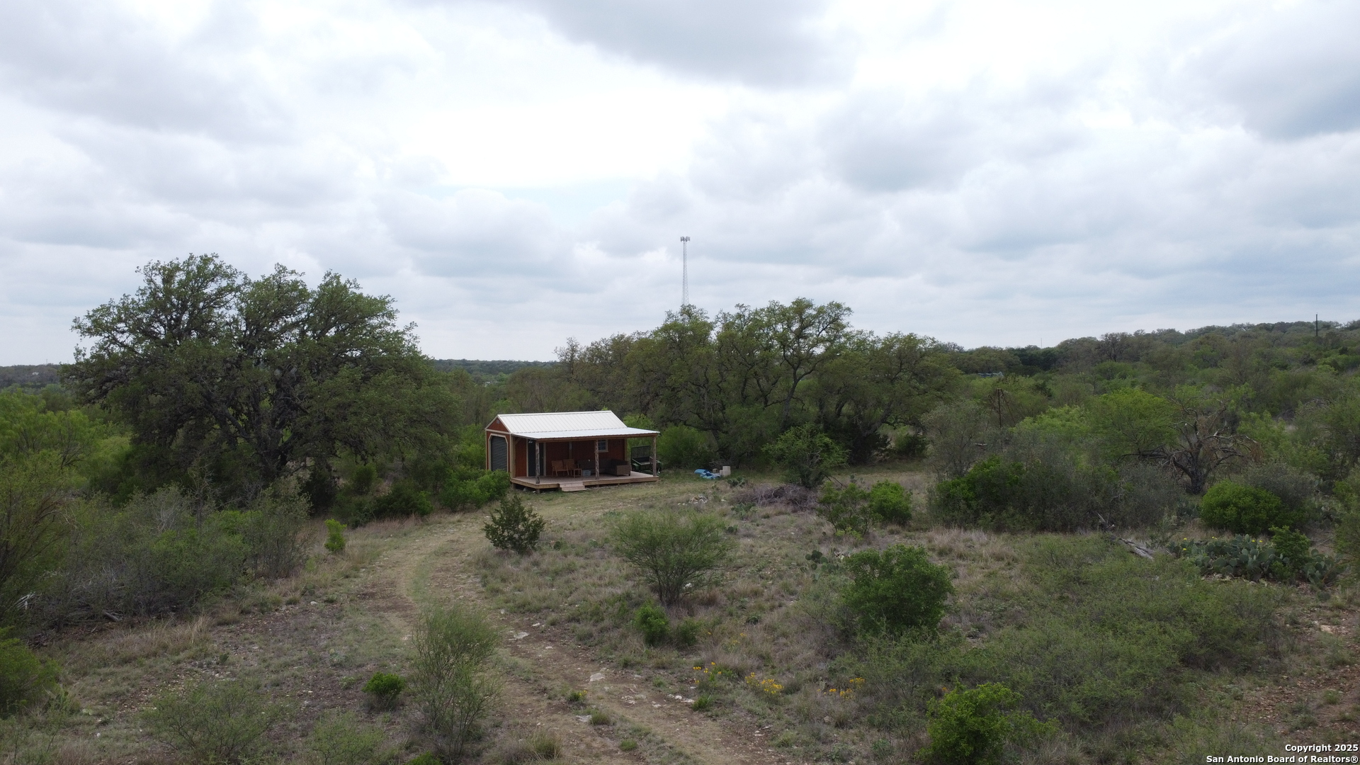 234 Pvt Road Sabinal, TX 78881 - Photo 17 of 32 a view of a bench in a field