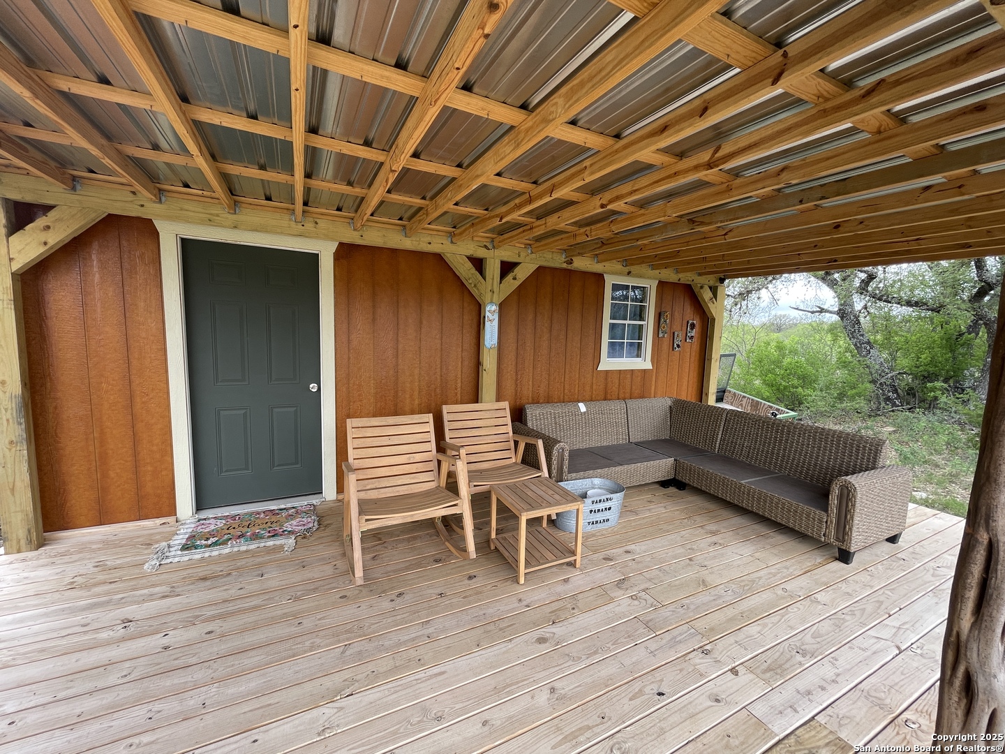 234 Pvt Road Sabinal, TX 78881 - Photo 25 of 32 a view of a chairs in wooden deck