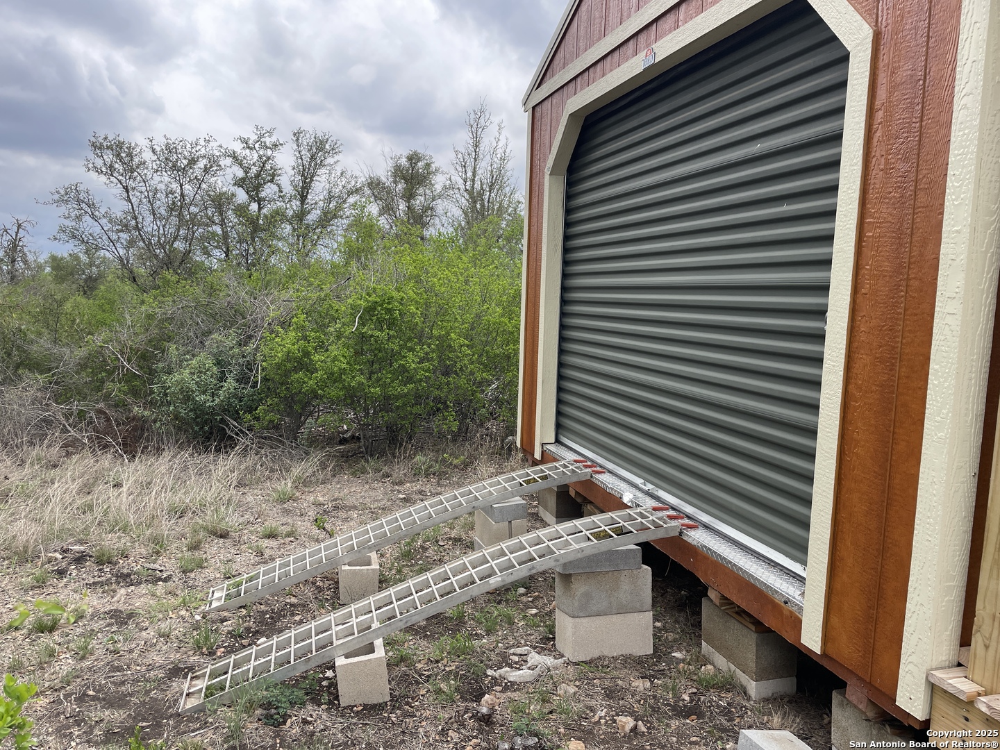 234 Pvt Road Sabinal, TX 78881 - Photo 26 of 32 a view of a back yard of the house