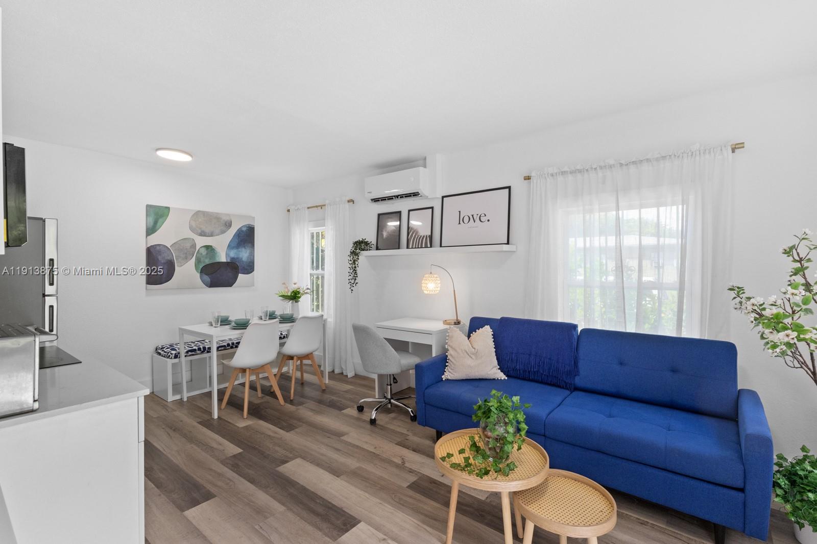 790 Northwest 60th Street Miami, FL 33127 - Photo 13 of 35 a living room with furniture and wooden floor