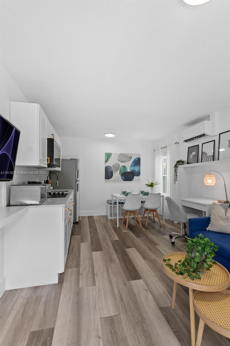 790 Northwest 60th Street Miami, FL 33127 - Photo 16 of 35 a living room with furniture and flowers