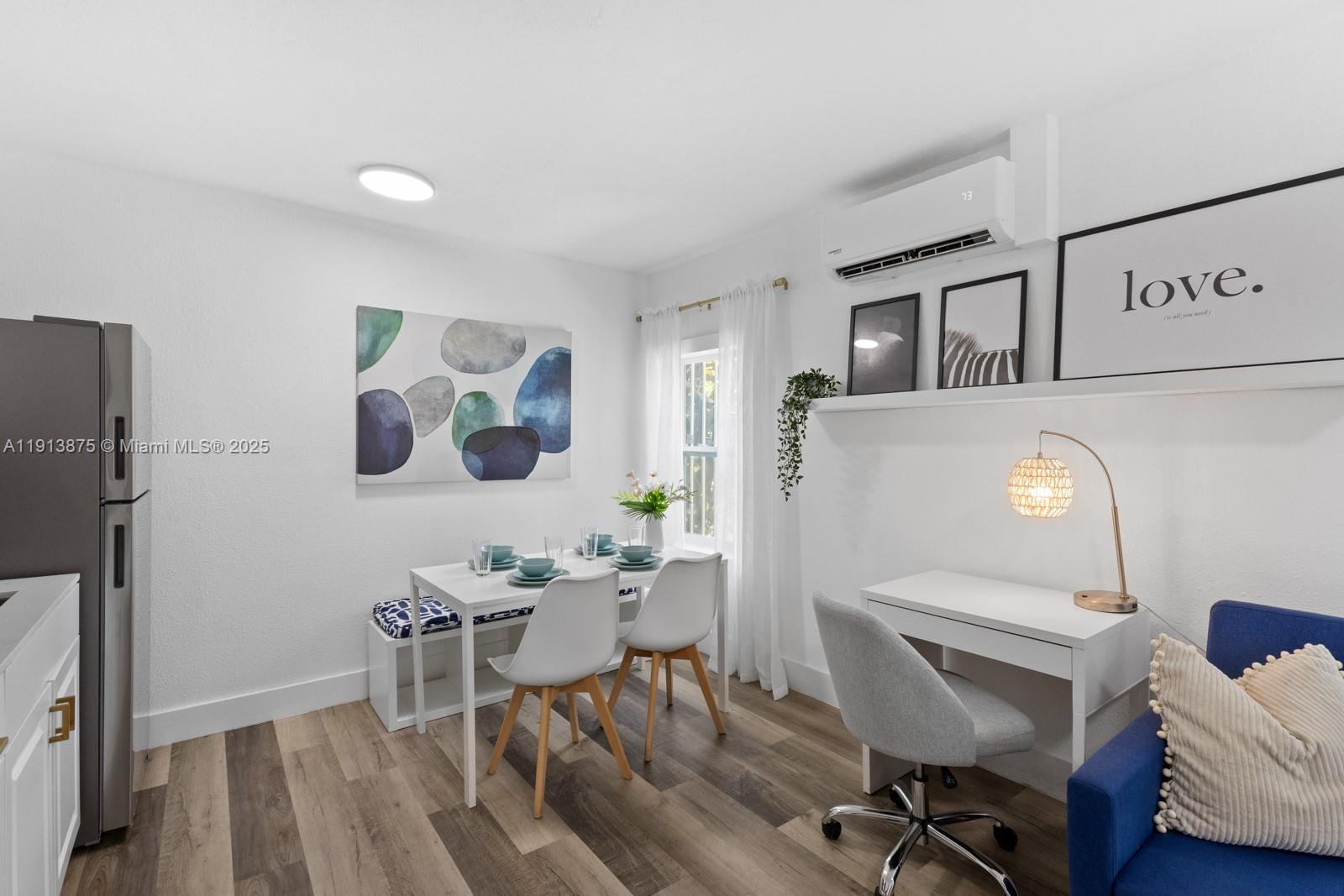 790 Northwest 60th Street Miami, FL 33127 - Photo 22 of 35 a workspace with furniture and wooden floor