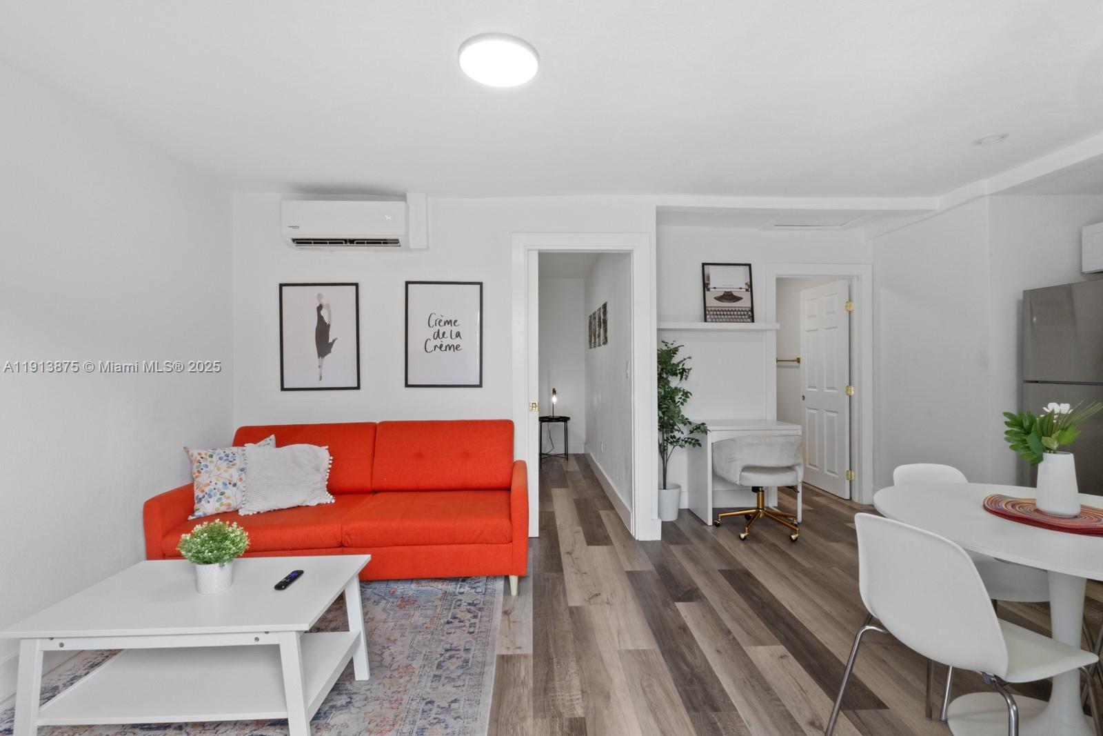 790 Northwest 60th Street Miami, FL 33127 - Photo 25 of 35 a living room with furniture and wooden floor