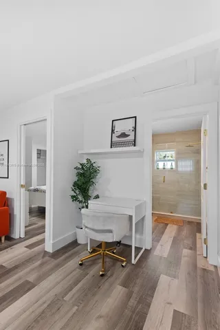 a view of a livingroom with furniture and a potted plant