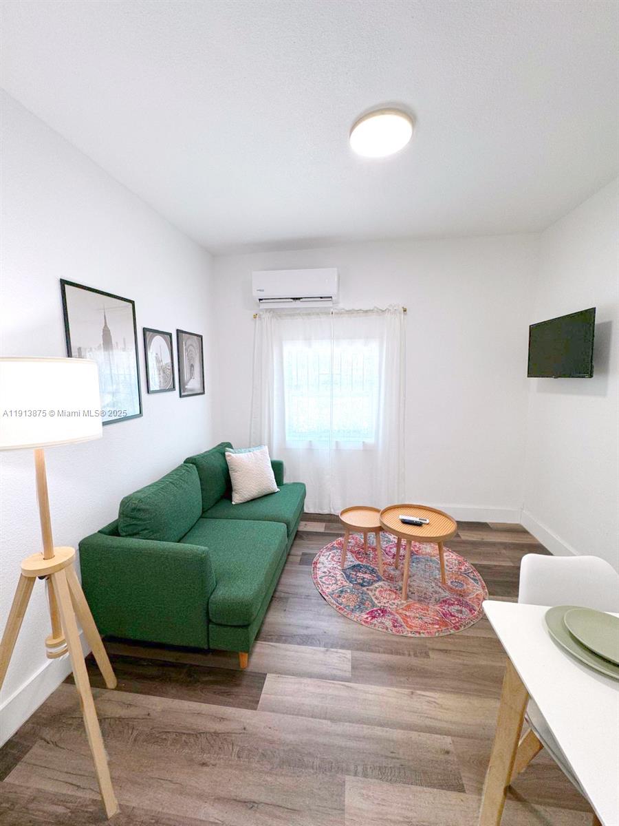 790 Northwest 60th Street Miami, FL 33127 - Photo 8 of 35 a bedroom with a bed and a couch