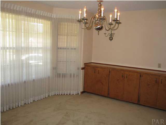 8818 Burning Tree Road Pensacola, FL 32514 - Photo 6 of 24 Formal dining area with large bay window