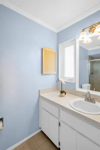 a white toilet sitting next to a shower