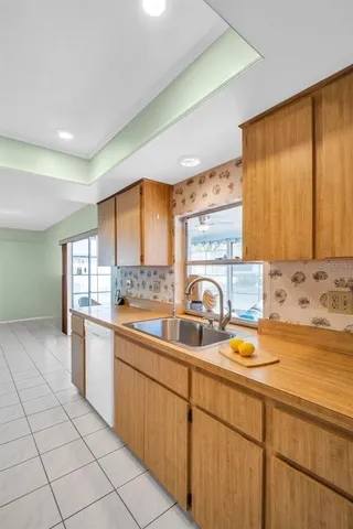 a bedroom with a bed and a television