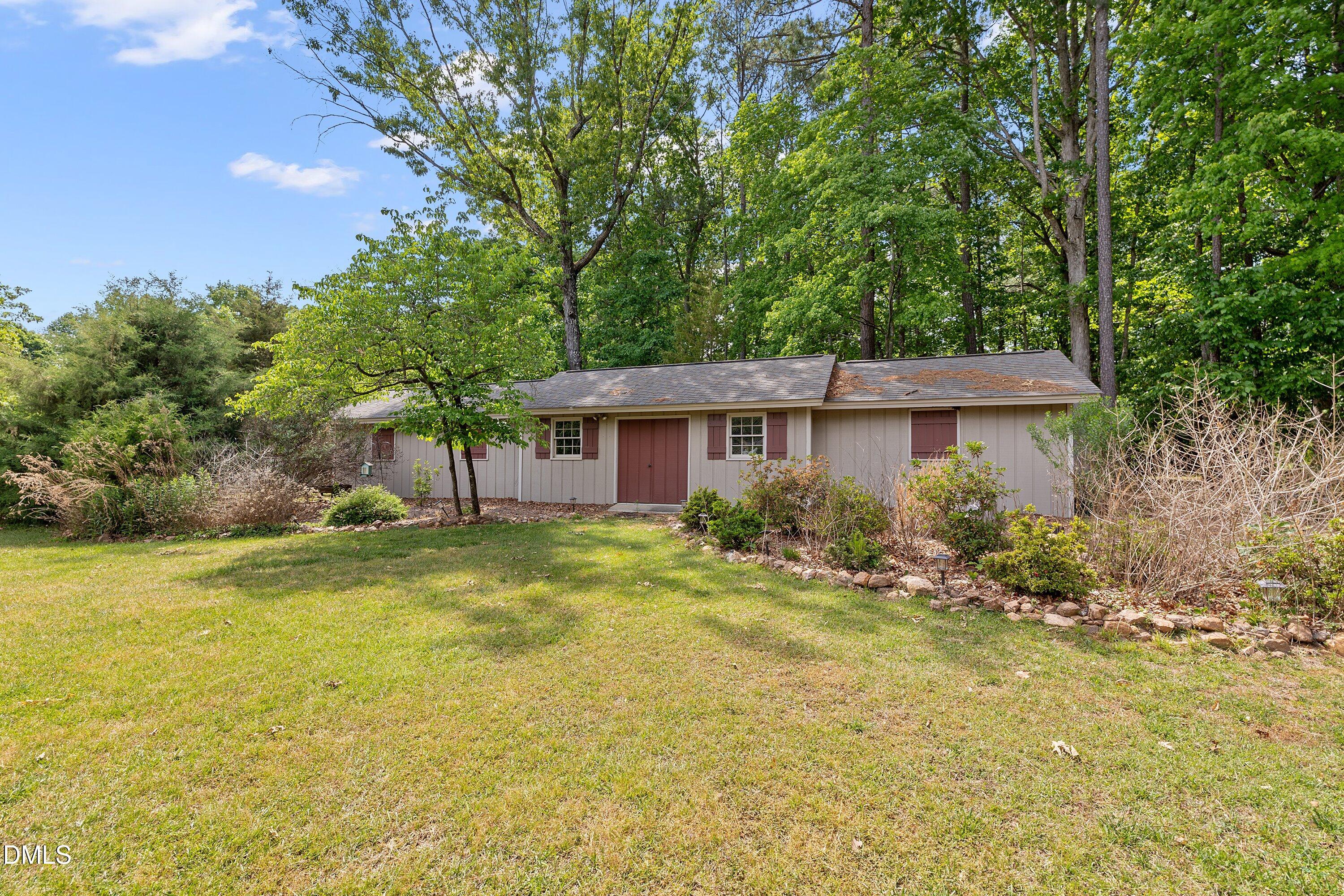 8133 Holly Forest Road Wake Forest, NC 27587 - Photo 47 of 50 a view of a house with backyard and garden