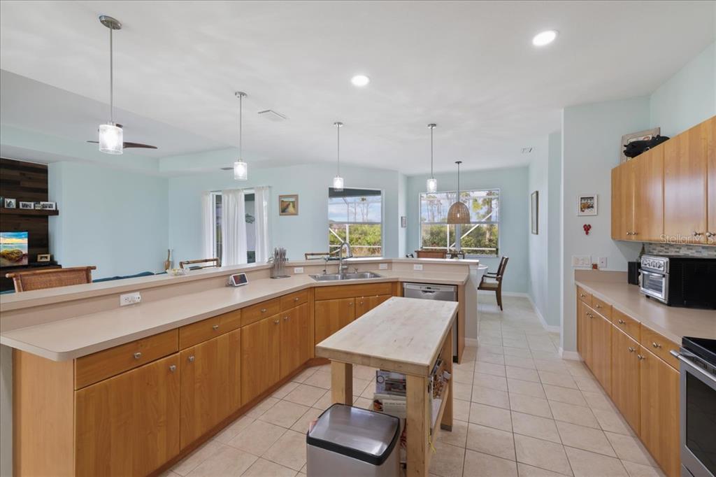 8 Abaft Place Placida, FL 33946 - Photo 11 of 45 a large kitchen with a table and chairs in it