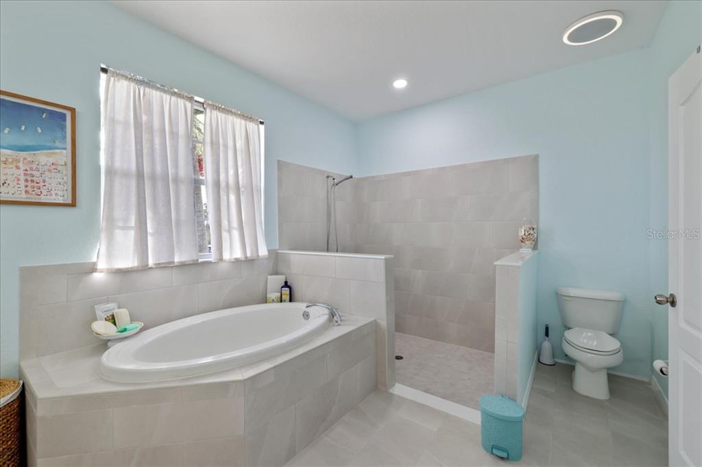 8 Abaft Place Placida, FL 33946 - Photo 18 of 45 a white bath tub sitting next to a white toilet