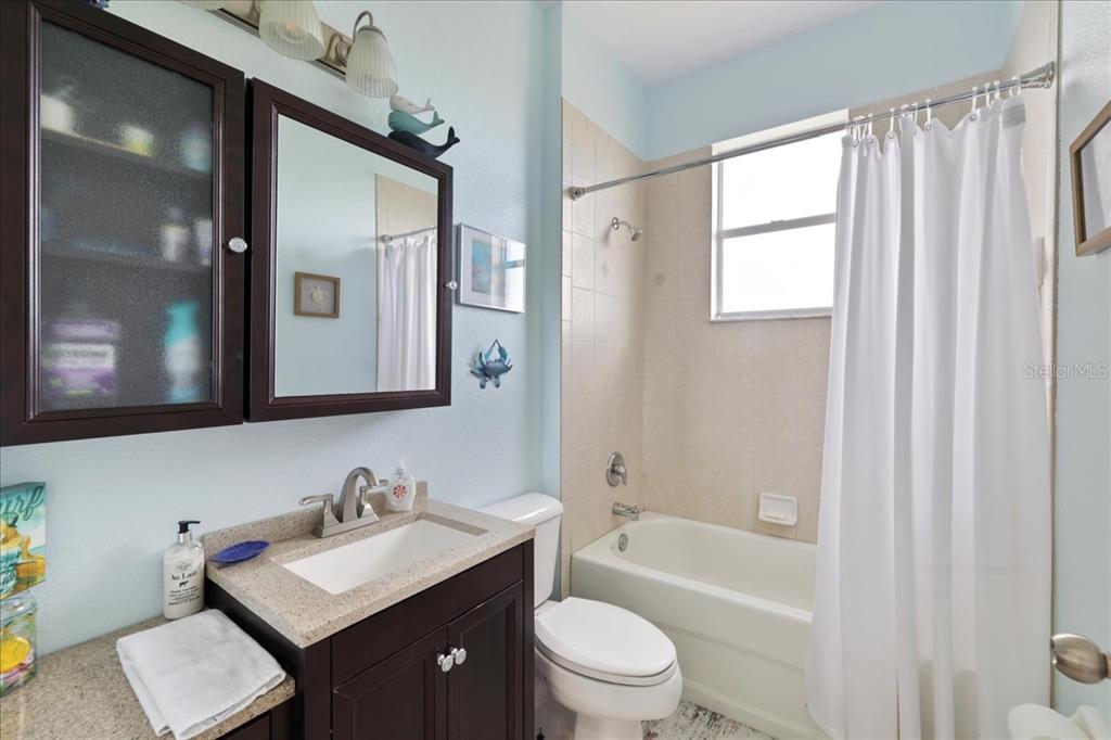 8 Abaft Place Placida, FL 33946 - Photo 21 of 45 a bathroom with a toilet a sink a mirror a bathtub and vanity