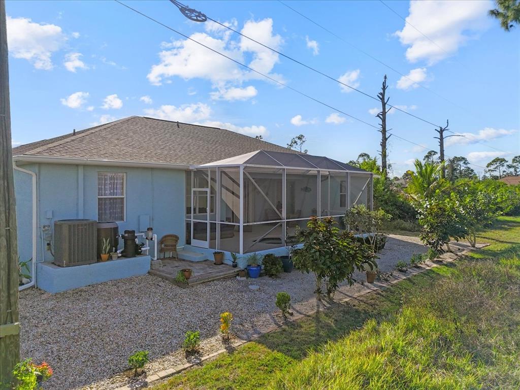 8 Abaft Place Placida, FL 33946 - Photo 31 of 45 a backyard of a house with yard fire pit and outdoor seating