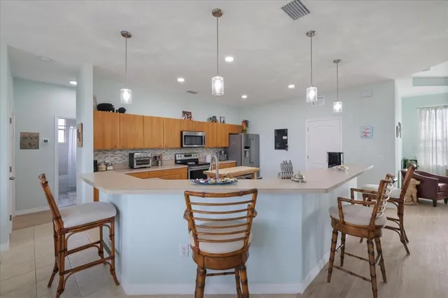 a kitchen with a sink a counter space and appliances