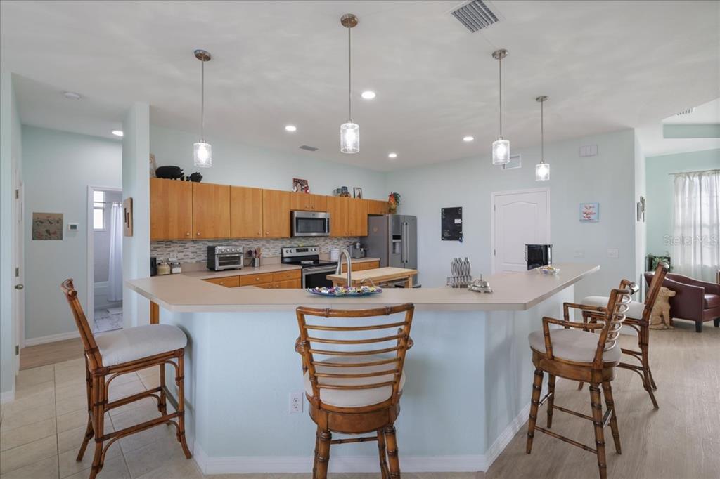 8 Abaft Place Placida, FL 33946 - Photo 8 of 45 a kitchen with cabinets and chairs