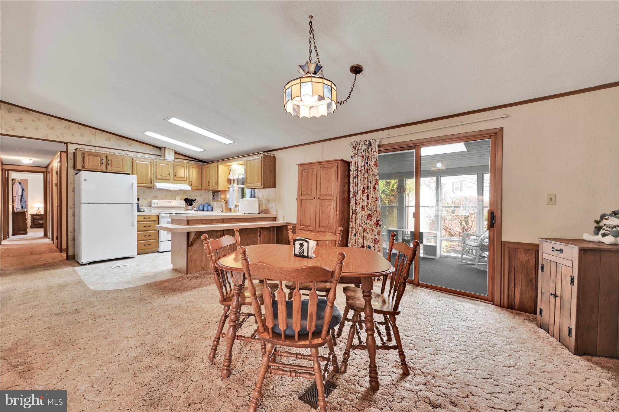 64 Maple Avenue Manheim, PA 17545 - Photo 11 of 36 a view of a dining room with furniture large window and wooden floor