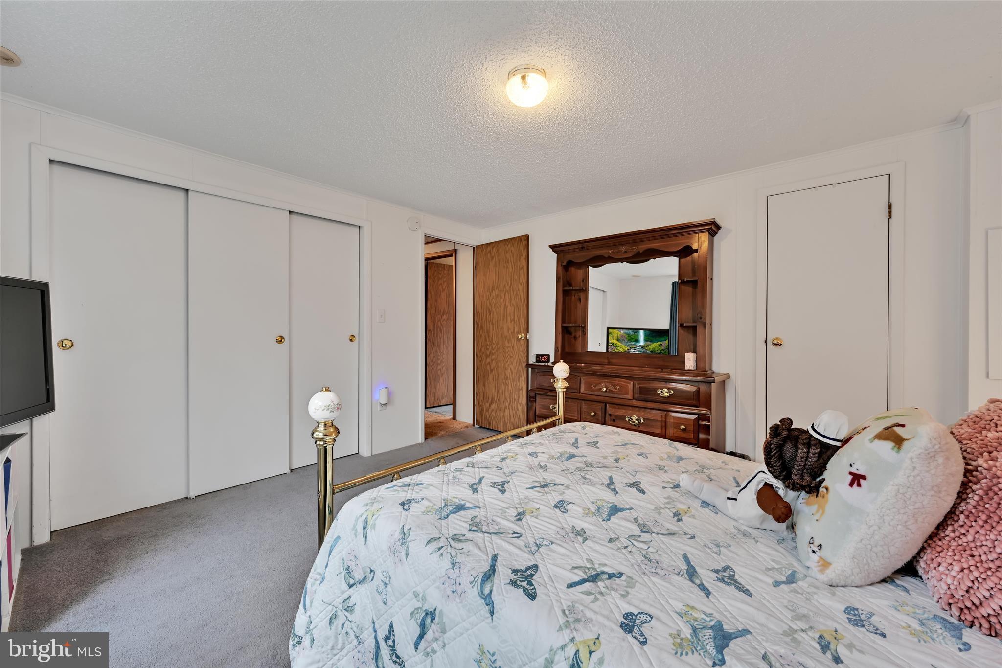 64 Maple Avenue Manheim, PA 17545 - Photo 19 of 36 a bed room with a bed and a television