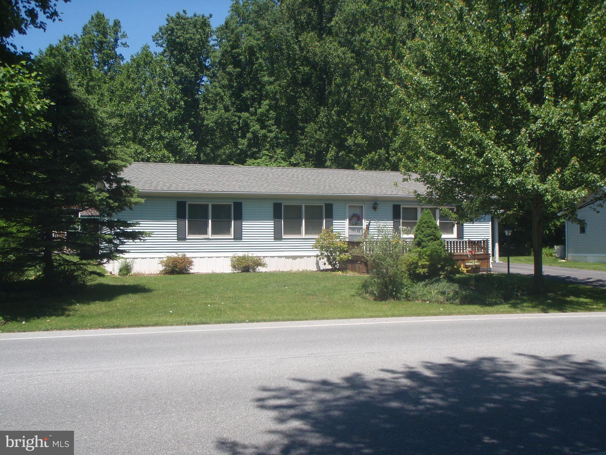 64 Maple Avenue Manheim, PA 17545 - Photo 2 of 36 a front view of a house with a yard and porch
