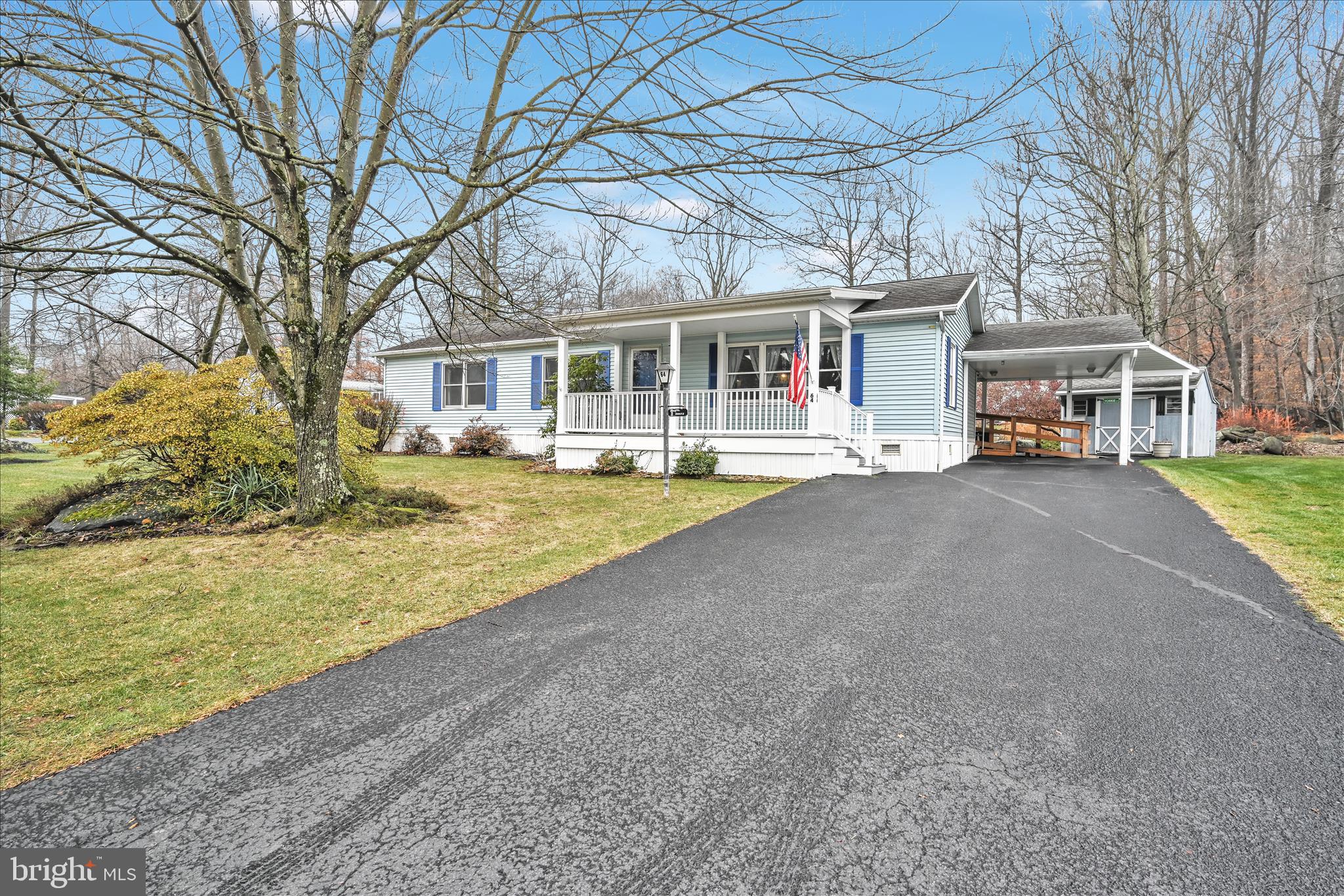 64 Maple Avenue Manheim, PA 17545 - Photo 5 of 36 a front view of a house with a big yard and large trees