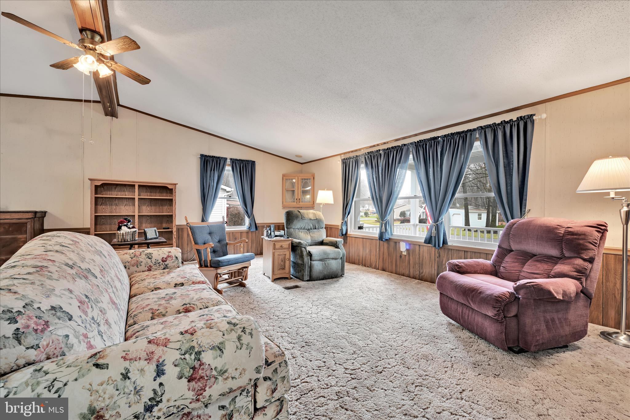 64 Maple Avenue Manheim, PA 17545 - Photo 10 of 36 a living room with furniture ceiling fan and a window