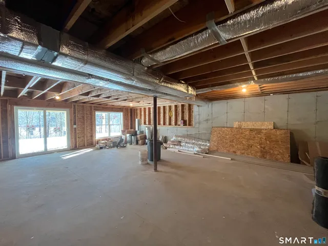 a view of an empty room with windows