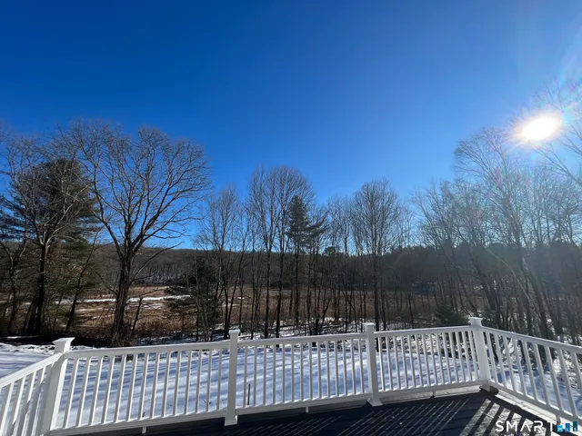 a view of house with a yard
