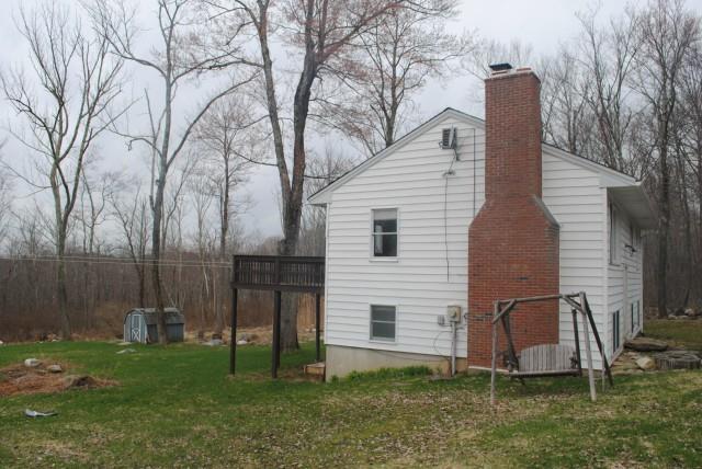151 Town Hill Road Warren, CT 06754 - Photo 1 of 1 a view of backyard with barbeque grill and a large tree
